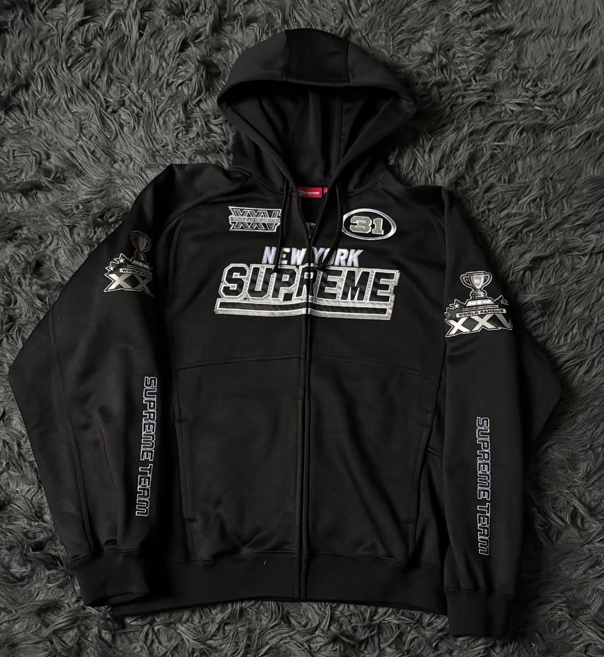SUPREME CHAMPIONS ZIP UP